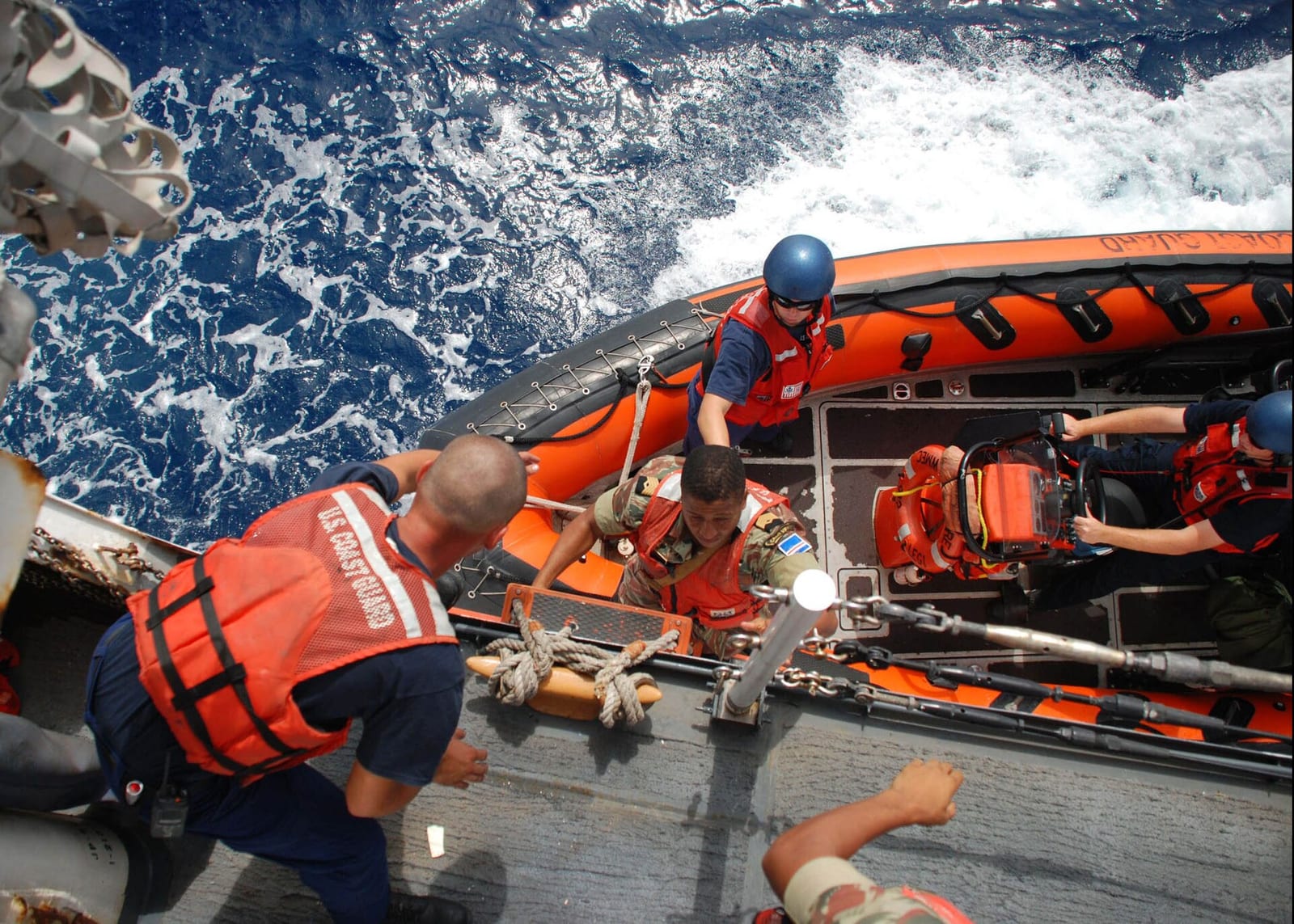 US Navy 090901-G-6414E-001 Master Chief Victor Delgado of the Cape Verde Coast Guard embarks a small boat from the U.S. Coast Guard Cutter Legare (WMEC 912) during an Africa Partnership Station investigation of a fishing boat.jpg